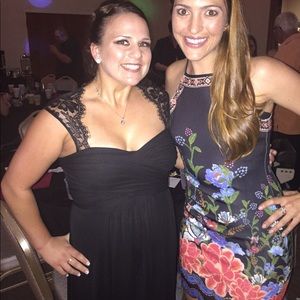 Super cute short black dress with bright colored floral pattern